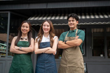 Portrait Group of  Asian cafe owners entrepreneurs smiling in coffee shop, small business concept