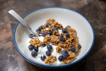 Yogurt with granola and blueberries