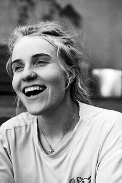 Young happy woman with dreadlocks smiling, portrait, close-up.