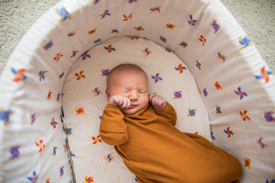 High angle view of squishy baby in a baby bed