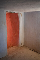 Fototapeta na wymiar Argueda caves abandoned interior living room with door, in Spain