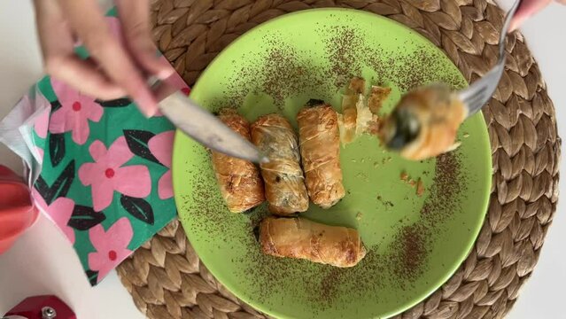 Coffee and crispy spinach rolls on a white table. Breakfast with fresh homemade pastries and coffee. Delicious Turkish Food.