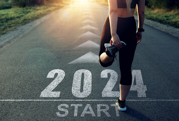  New Year 2024 with new ambitions, challenge, plans, goals and visions.Sports girl who wants to start the year 2024. Concept of new professional achievements in the new year and success. - obrazy, fototapety, plakaty
