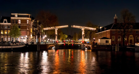 Night Shot of Walter S&uuml;skinbrug where the Nieuwe Herengracht Canal Meets the Amstel River, Amsterdam, Holland