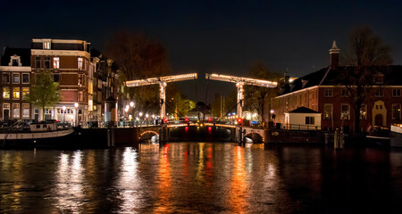 Night Shot of Walter Süskinbrug where the Nieuwe Herengracht Canal Meets the Amstel River, Amsterdam, Holland