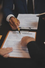 .Business and lawyers discussing contract papers with brass scale on desk in office. Law, legal...