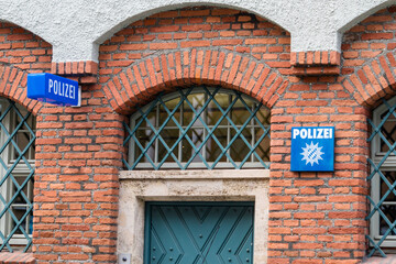 Archways with iron gate on police station