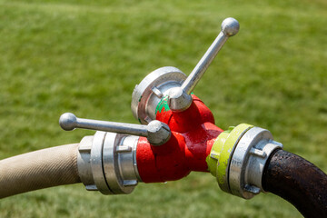 Close up on water hose valve outdoors