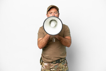 Middle age military with dog tag isolated on white background shouting through a megaphone