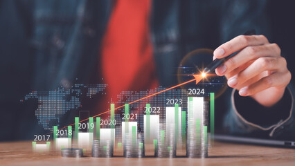Businessman showing business growth and success graph ,concept of progress in development, financial efficiency and investment with business strategy for goals and opportunities in industry future