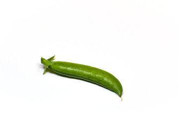 A pod of green peas on a white background. Delicious sweet vegetable close-up.