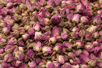 Dry tea roses isolated on white background.