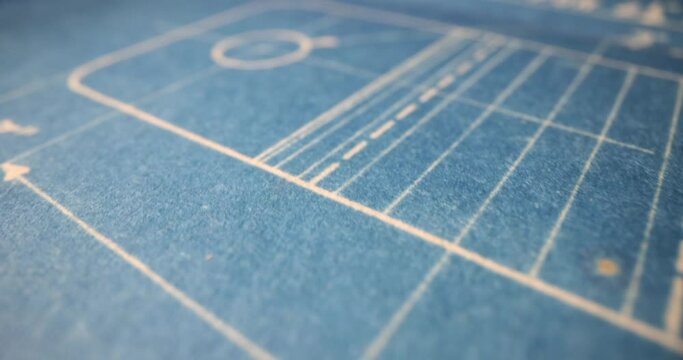 Blue paper sheet with maths formulas for geometric problem. Concept of creating material with drawn sketch and maths formulas on blueprint