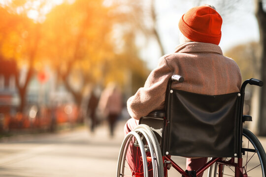 Unrecognizable Disabled Senior Woman In Wheelchair At Home