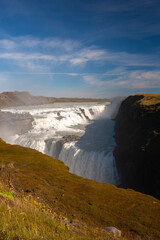 Gullfoss iconic waterfall known for its multi-step cascade along a 90° bend of the Hvitá River.
