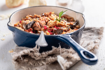 Spicy and homemade stew with sauerkraut, cabbage and spices.
