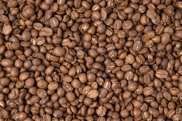 Roasted coffee beans top view wallpaper background.