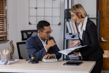 Business Asian people and lawyers, Businessman and lawyer discuss the contract document. Judge gavel deciding on marriage divorce signing papers. lawyer concept.