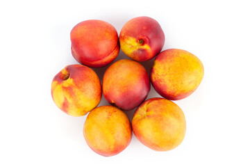 Fresh nectarines fruits isolated on white background. Ripe peach top view.