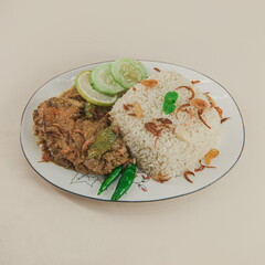 A traditional rice dish Pilaf or pilau is homemade and decorated with chicken roast..