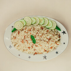 A traditional rice dish Pilaf or pilau is homemade and decorated with chicken roast..