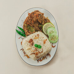 A traditional rice dish Pilaf or pilau is homemade and decorated with chicken roast..