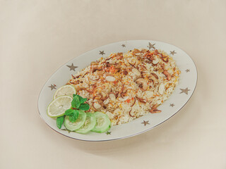 A traditional rice dish Pilaf or pilau is homemade and decorated with chicken roast..