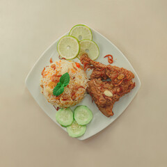 A traditional rice dish Pilaf or pilau is homemade and decorated with chicken roast..