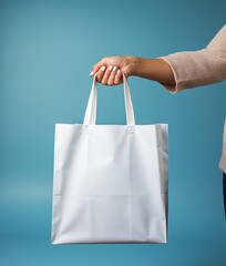 hand holding shopping bags