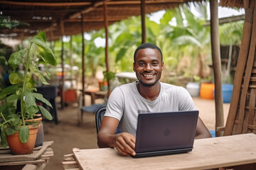  Young African farmer with a laptop, technology in the agriculture concept. - obrazy, fototapety, plakaty