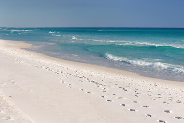 Sand and waves at Henderson Beach State Park, located along the Emerald Coast in Destin, Florida