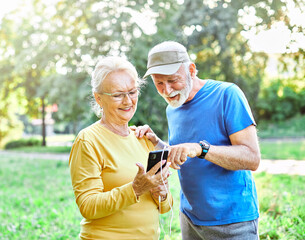 woman man outdoor senior couple retirement elderly phone fitness mobile smartphone music app communication active together love old nature using internet smart mature retired vitality healthy love