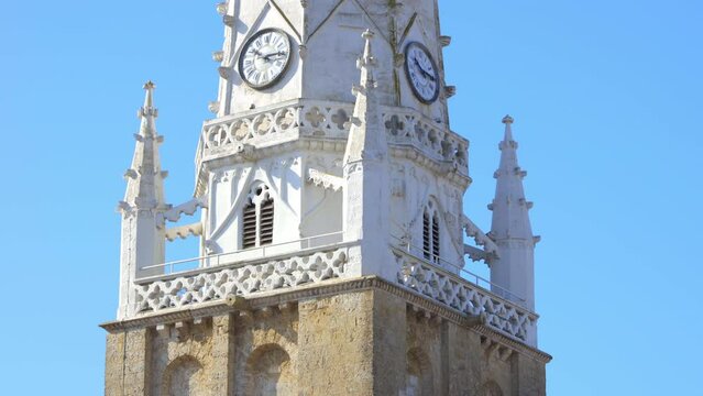 Close up on the bell tower and the clocks of Saint-Etienne church in Ars-en-R&eacute;, France