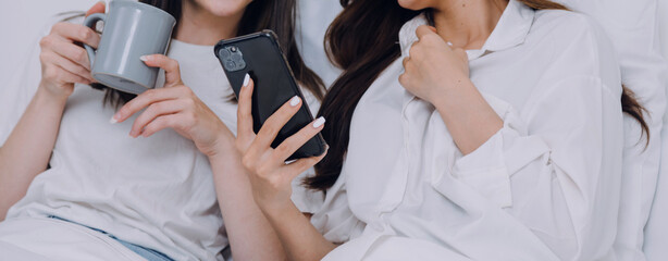 Happy young lesbian couple taking selfie together, Couple of friends relaxing and spending time on weekend at home, Couple of female lovers with good relationship, Concept of LGBTQ