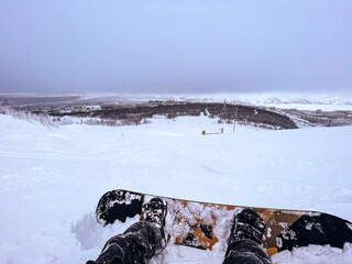 snowboard in mountains Bigwood resort Kirovsk first person view
