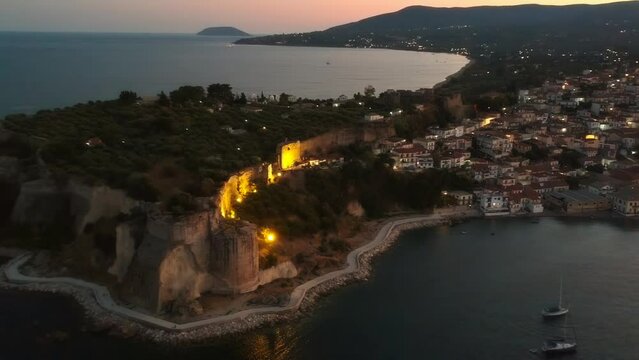 Aerial view over Koroni seaside city illuminated at night. Koroni, Messenia, Greece