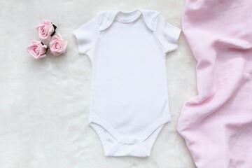 Layout Flat Lay white baby shirt bodysuit, on a pink accessory , for girls. Mock up for design and placement of logos, advertisements