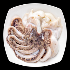 fresh raw octopus in plate isolated on black background, ingredient for seafood cooking, top view, flat lay, square ratio