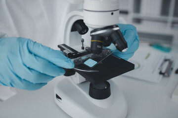 Lab practitioner working on chemical research for chemical reactions, does a chemical experiment and examines a patient's blood sample. Medicine and research concept.