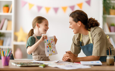 kid and teacher at the art class