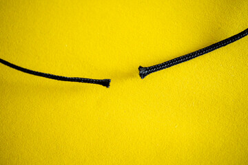 Close up of a Broken Rope. Discontinuity, Betrayal, Divorce, Separation Concept Image.