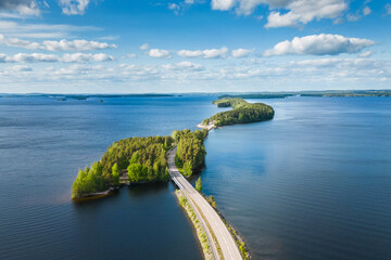 Aerial view of Pulkkilanharju Ridge, Paijanne National Park, southern part of Lake Paijanne. Blue lakes and a winding road from above © Photofex