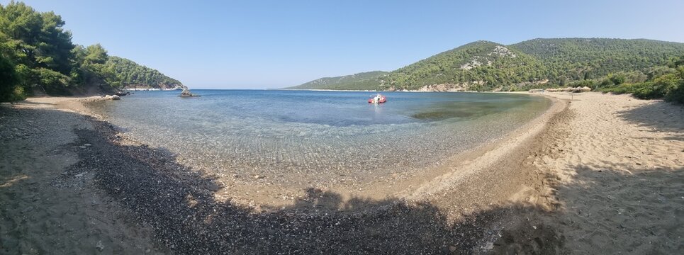 skyros or skiros island, pefkos beach pine trees beside the sea summer destination in greece