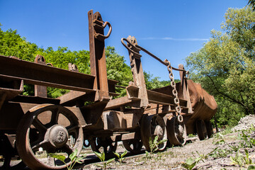 Old rusty train wagon forever parked at an abandoned railway station used for excavation of charcoal from underground mine, near Despotovac city, Serbia