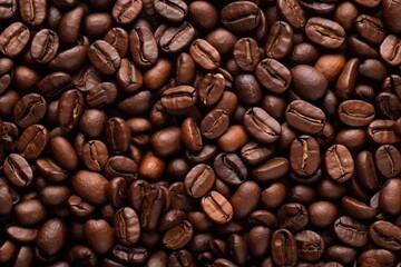 Obraz premium Fresh roasted coffee beans closeup pattern on dark background. Food pattern. Love coffee concept. Top view, flat lay with copy space