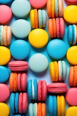 Fototapeta na wymiar Macaron or macaroon pattern on colored background. Sweet and colorful different types of french almond cookies on dessert. Gift for Valentine's Day, party, birthday or holiday. Top view