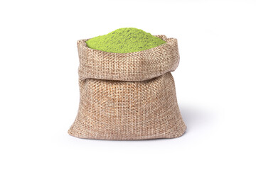 Green herbal powder in hemp sack bag isolated on white background.