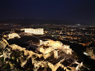 Fototapeta na wymiar Aerial view of the illuminated Acropolis of Athens at night. Greece.