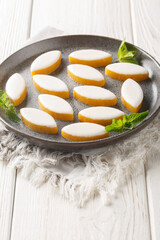 French candy Calissons consisting of pale yellow homogeneous paste of candied fruit melons and...