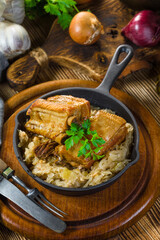Traditional spare ribs baked in sauerkraut.